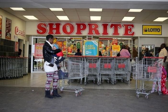 A shopper is seen outside a Shoprite store in Johannesburg July 7, 2015. REUTERS/Siphiwe Sibeko