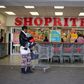 A shopper is seen outside a Shoprite store in Johannesburg July 7, 2015. REUTERS/Siphiwe Sibeko