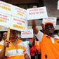 Striking workers at Ivory Coast's state oil company Petroci hold up signs during a 72-hour strike to protest a wave of recent layoffs in Abidjan, Ivory Coast, February 3, 2016. The signs say (clockwise from top right) "Until the end," "Respect our righ...