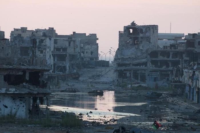 Damaged homes are seen after clashes between members of the Libyan pro-government forces and Shura Council of Libyan Revolutionaries, in a file photo. REUTERS/Stringer