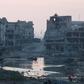 Damaged homes are seen after clashes between members of the Libyan pro-government forces and Shura Council of Libyan Revolutionaries, in a file photo. REUTERS/Stringer