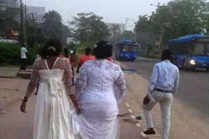 A stranded bride trekking on the expressway as Lagos City Marathon held on Saturday, February 6, 2016