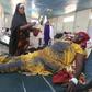 A woman recovers from effects of drinking contaminated water from a well, at a hospital in Yaqshid district in Somalia's capital Mogadishu December 13, 2014. REUTERS/Feisal Omar
