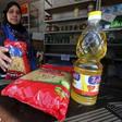 A worker sells subsidized food commodities at a government-run supermarket in Cairo, Egypt, February 14, 2016. Tens of millions of Egyptians rely on state subsidies provided as credits on smartcards they redeem against household staples each month. But...