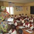 Ekiti State ex-governor's wife, Erelu Bisi Fayemi, teaching Primary 4 pupils of the SUBEB Model Nursery and Primary School, Efon-Alaye.
