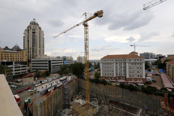 Construction is seen below the skyline of Johannesburg's upmarket Sandton suburb, February 5, 2016. . REUTERS/Mike Hutchings