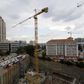 Construction is seen below the skyline of Johannesburg's upmarket Sandton suburb, February 5, 2016. . REUTERS/Mike Hutchings