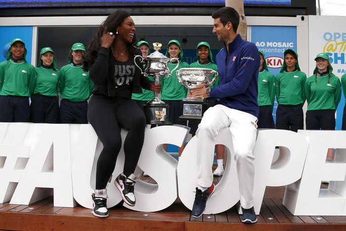 Current Australian Open Men's and Women's champions Serbia's Novak Djokovic and Serena Williams of the U.S. hold their trophies as they pose for a photograph after arriving for the official draw ceremony at Melbourne Park, Australia, January 15, 2016. ...