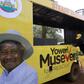 A woman gets off a truck with pictures of National Resistance Movement (NRM) party candidate Yoweri Museveni in Masindi town January 23, 2016 ahead of the February 18 presidential election. REUTERS/James Akena