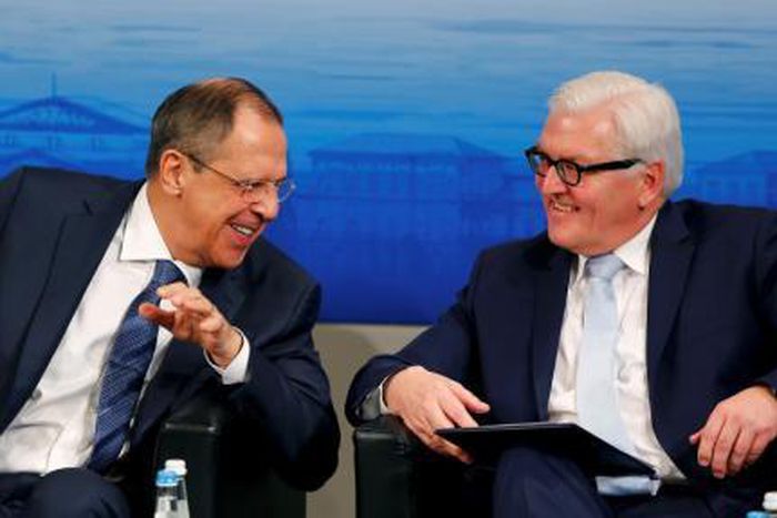 Russian Foreign Minister Sergei Lavrov (L) speaks to German Foreign Minister Frank-Walter Steinmeier at the Munich Security Conference in Munich, Germany, in this February 13, 2016 file picture.