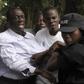 Ugandan policemen arrest opposition leader Kizza Besigye (L) ahead of a rally to demonstrate against corruption and economic hardships in Uganda's capital Kampala January 19, 2012. Ugandan police fired tear gas before bundling opposition leader Besigye...