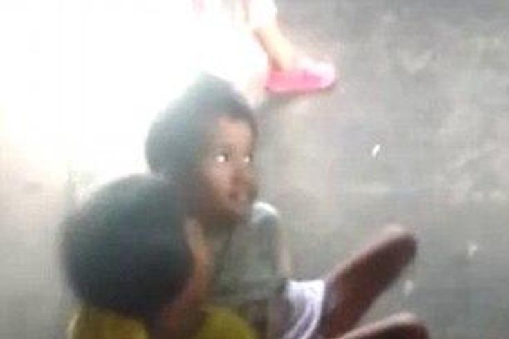 7-year-old twins joined at the waist shopping at the market goes viral