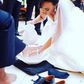 Bride washing her groom's feet