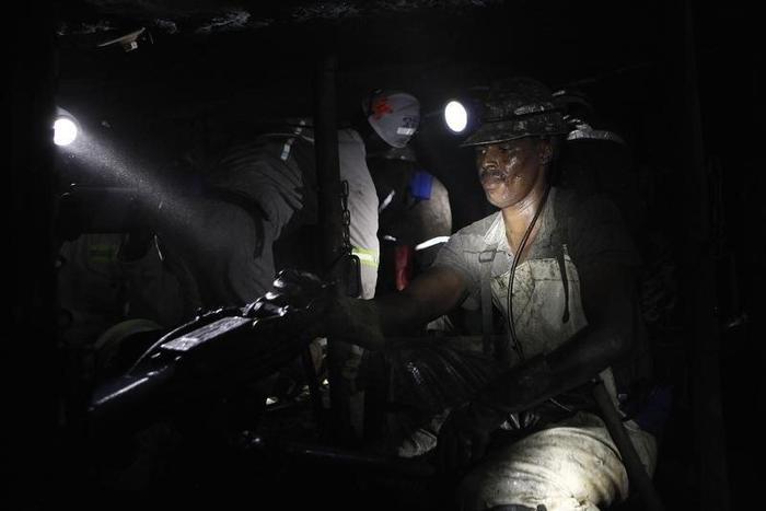 A miner is seen underground at Lonmin Plc's Karee mine in Marikana, Rustenburg 100 km (62 miles) northwest of Johannesburg, March 5, 2013. REUTERS/Siphiwe Sibeko