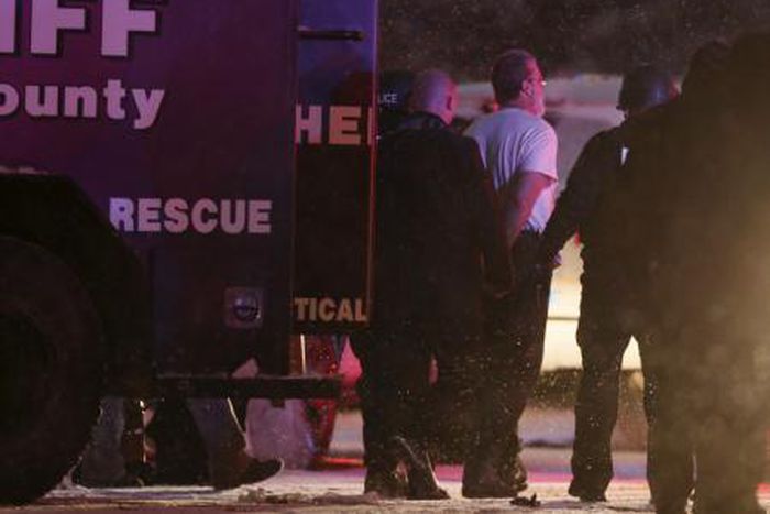 A suspect is taken into custody outside a Planned Parenthood center in Colorado Springs, Colorado November 27, 2015.