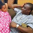King Wasiu Ayinde Marshall with his daughter.