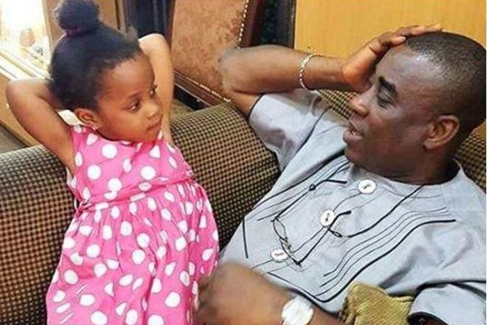King Wasiu Ayinde Marshall with his daughter.