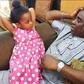 King Wasiu Ayinde Marshall with his daughter.