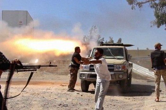 A freelance journalist travelling with the Misarata brigade shows fighters from the Islamist Misarata brigade firing towards Tripoli airport.