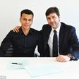 Dele Alli with manager Mauricio Pochettino after signing a new contract at Tottenham until 2021