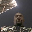 Floyd Mayweather in front of the Burj Khalifa Hotel in Dubai as he holidays in Dubai