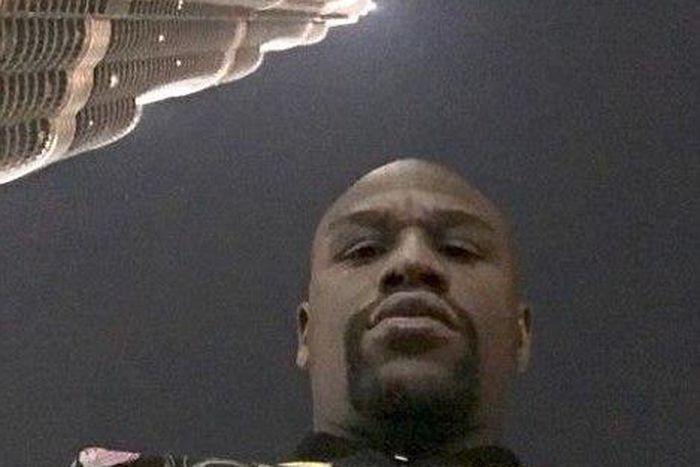 Floyd Mayweather in front of the Burj Khalifa Hotel in Dubai as he holidays in Dubai