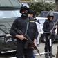 Police stand guard at a square in central Cairo January 26, 2015. REUTERS/Asmaa Waguih
