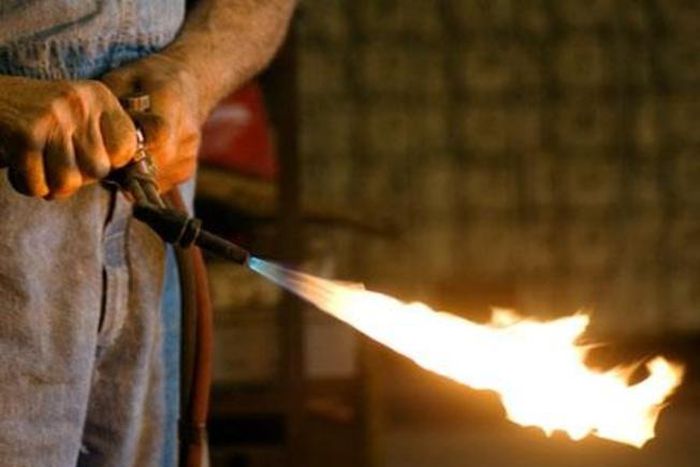 Pastor sets church member on fire