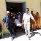 A Somali man injured in a mortar attack is carried on a stretcher by relatives at Darul Shifa Hospital in the capital Mogadishu February 25, 2016. REUTERS/Feisal Omar