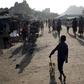 A Karamojong tribe boy plays with a toy decorated with election posters in town of Kaabong in Karamoja region, Uganda February 17, 2016. REUTERS/Goran Tomasevic