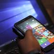 A Microsoft delegate checks applications on a smartphone during the launch of the Windows 10 operating system in Kenya's capital Nairobi, July 29, 2015. REUTERS/Thomas Mukoya