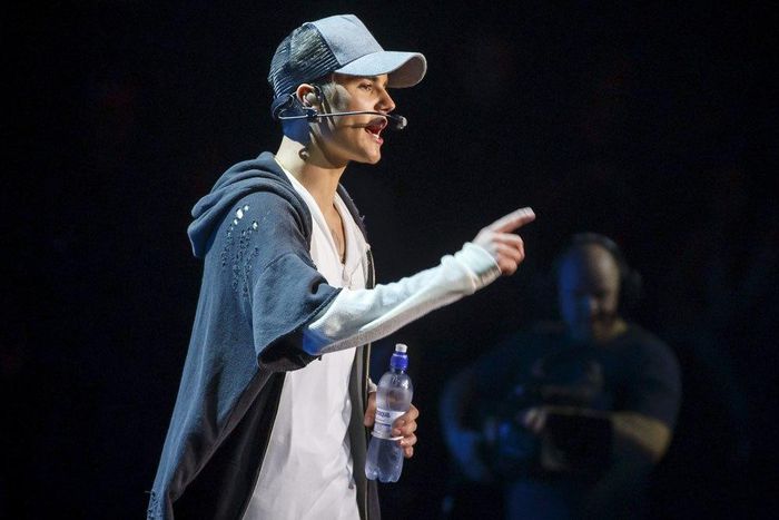 Singer Justin Bieber stands on stage during a concert in Oslo October 29, 2015