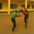 Tee A boxing with his trainer
