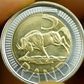 A   five rand coin is displayed by a South African Reserve emplyee in a file photo.  REUTERS/ Juda Ngwenya
