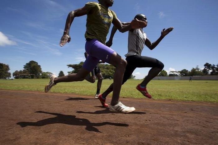 Athletes sprint during a training session on a dirt track in the town of Iten in western Kenya, November 13, 2015. REUTERS/Siegfried Modola