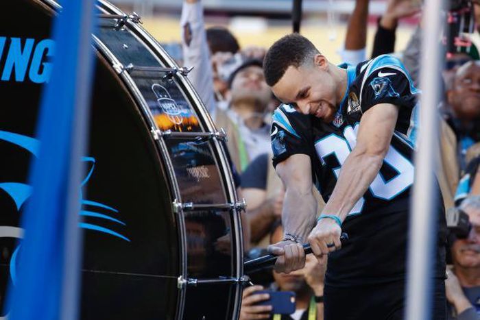 Steph Curry beating the Panthers drum at the Super Bowl 50