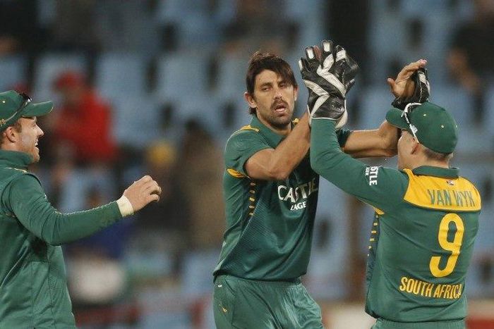 South Africa's David Wiese (C) is congratulated by team mate Morne van Wyk after bowling out New Zealand's James Neesham during their first ODI cricket match in Centurion, August 19, 2015. REUTERS/Siphiwe Sibeko