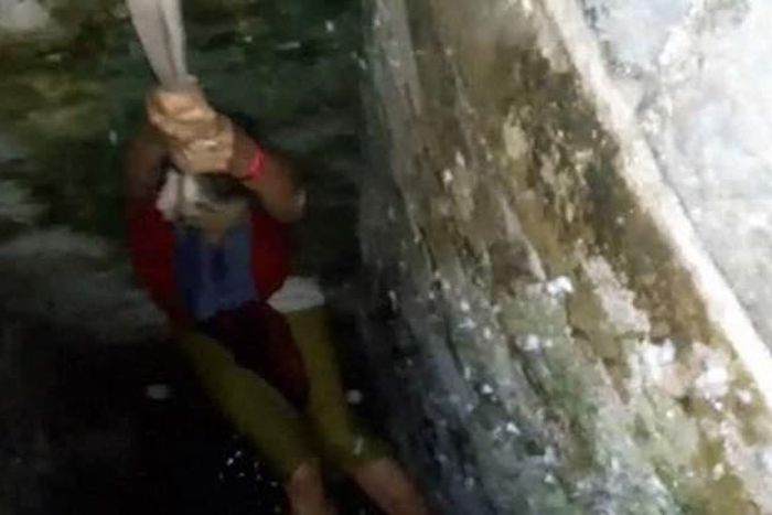 Tourist obsessed with taking selfie falls into a well