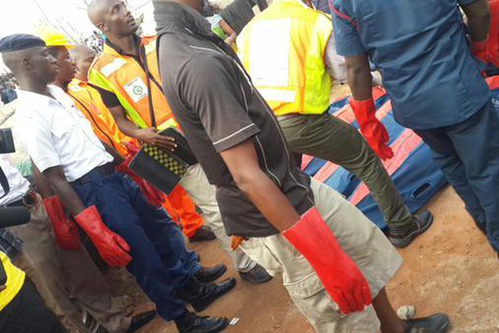 NEMA officials at the scene of a helicopter crash in Oworonshoki, Lagos on August 12, 2015