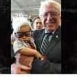 Bernie Sanders holding Oliver Jack Carter Lomas-Davis