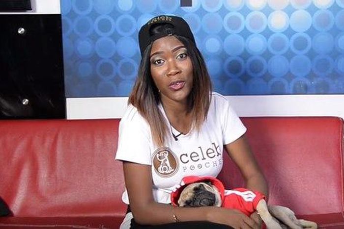 Lily Aguiyi at the Pulse TV studio with her dog - a pug, Gucci.