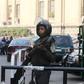 A member of the riot police stands guard outside the high court in Cairo, Egypt, January 21, 2016. REUTERS/Mohamed Abd El Ghany