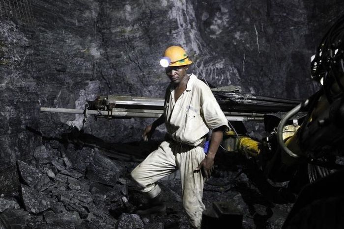 A mine worker is seen underground in South Deep mine outside Johannesburg June 4,2010. REUTERS/Siphiwe Sibeko