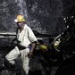 A mine worker is seen underground in South Deep mine outside Johannesburg June 4,2010. REUTERS/Siphiwe Sibeko