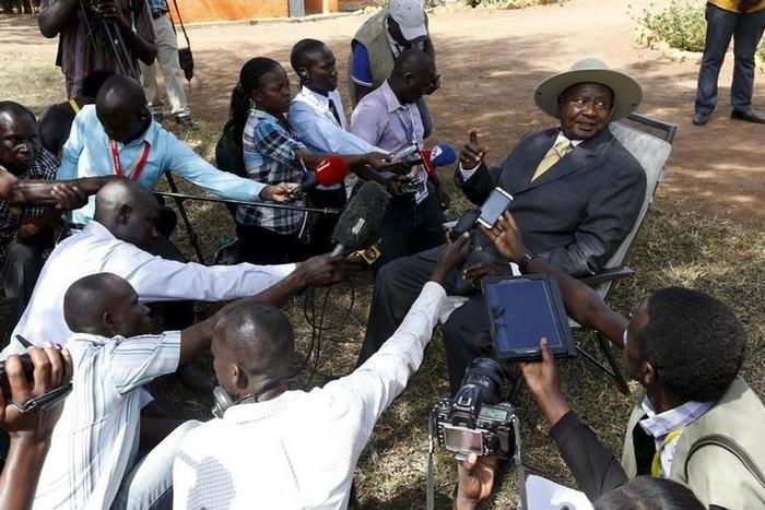 Uganda's incumbent President Yoweri Museveni speaks to the media soon after casting his vote at a polling station during the presidential elections in Kirihura in western Uganda, February 18, 2016. REUTERS/James Akena