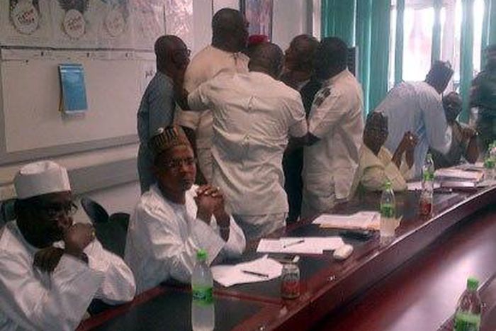 Amaju Pinnick and Chris Giwa are pictured having a brawl