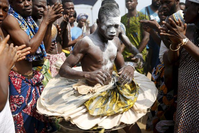 A devotee is cheered as he dances at the annual voodoo festival in Ouidah January 10, 2016. REUTERS/Akintunde Akinleye