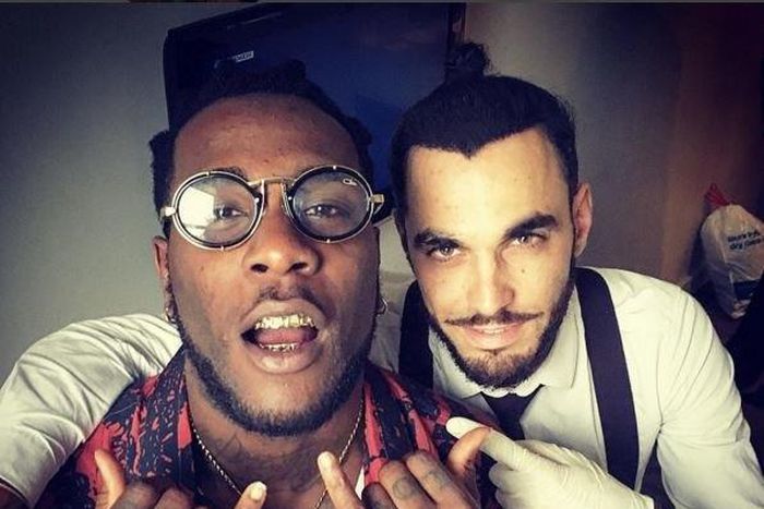 Burna Boy, 24, showing off his grill.