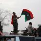 Armed Libyan men wave their national flags in celebrations marking the fifth anniversary of the Libyan revolution, in Benghazi, Libya February 17, 2016. REUTERS/Esam Omran Al-Fetori