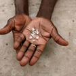 A diamond dealer from Zimbabwe displays diamonds for sale in Manica, near the border with Zimbabwe, September 19, 2010. REUTERS/Goran Tomasevic